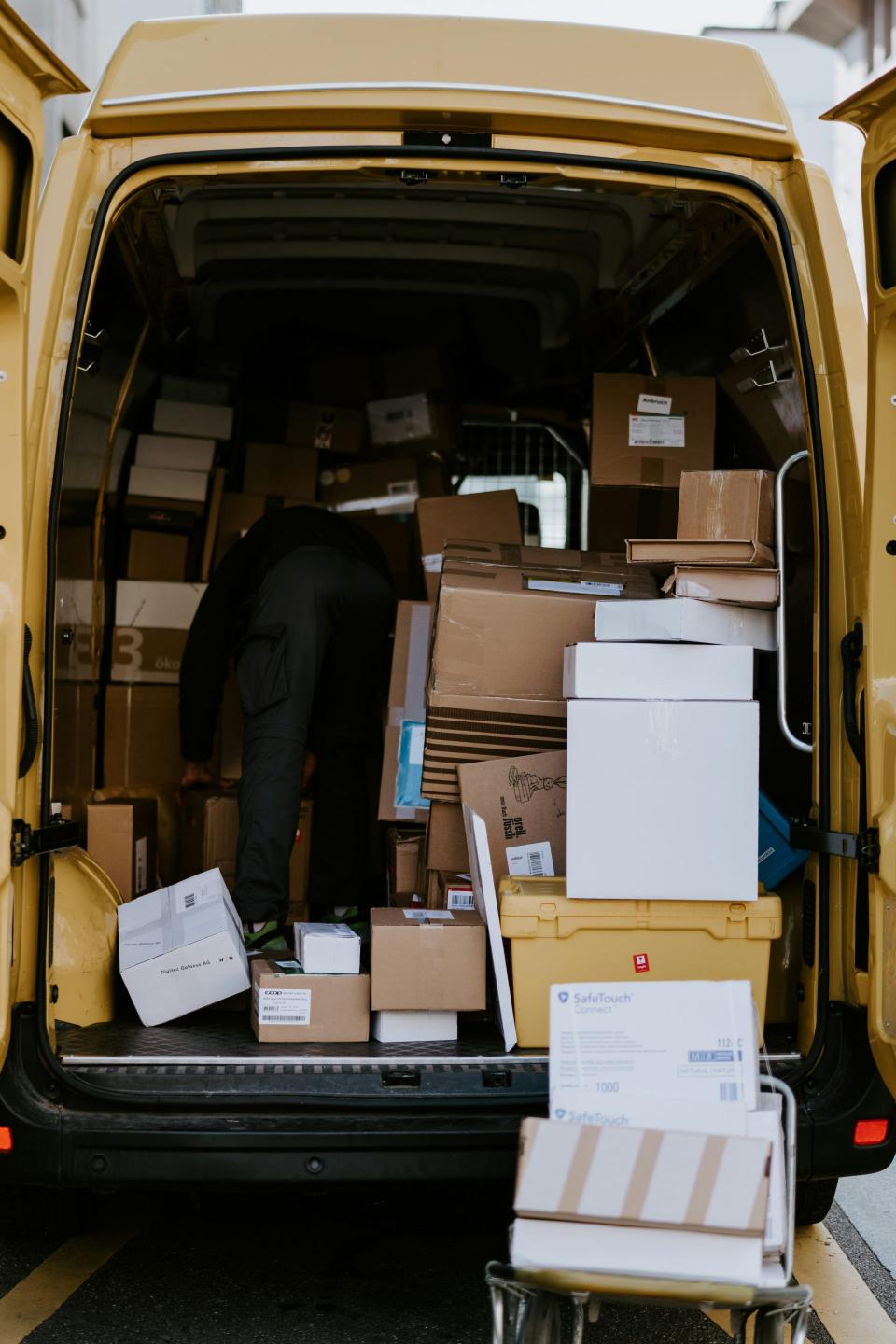 Delivery van loaded with various sized packages.